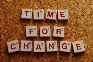 Scrabble letters that spell out "time for change" signaling why it is important to declutter.