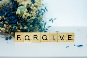 The word forgive is written in scrabble letters.